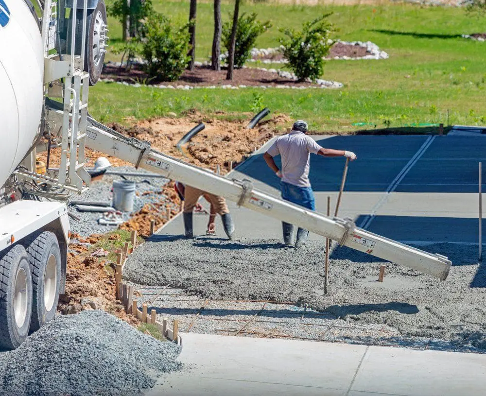 contractors from Dade Decorative Concrete performing driveway resurfacing in Coral Gables