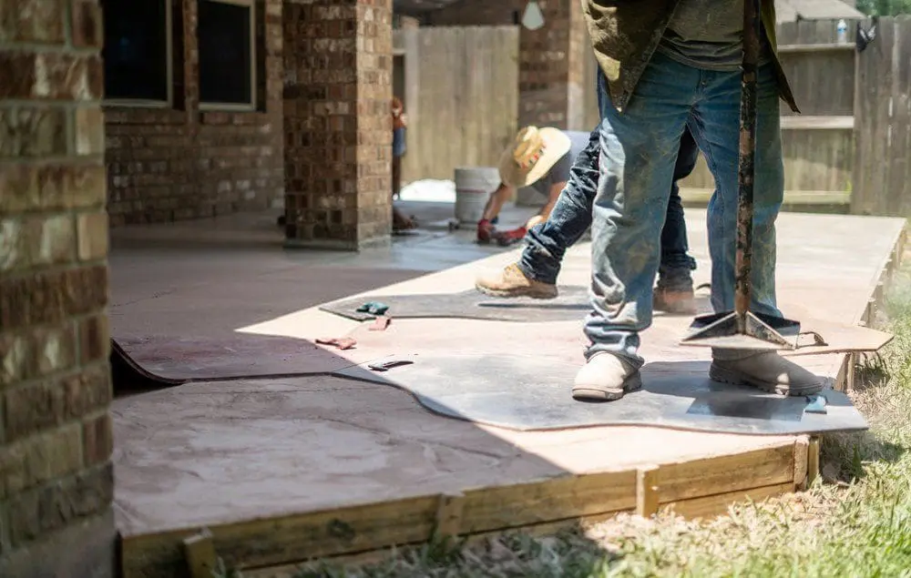 Dade Decorative Concrete experts installing a stamped concrete patio in a Coral Gables residential property